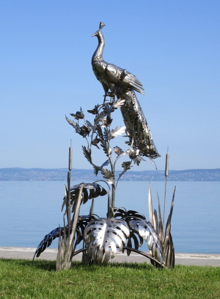 Peacock on tree garden sculpture